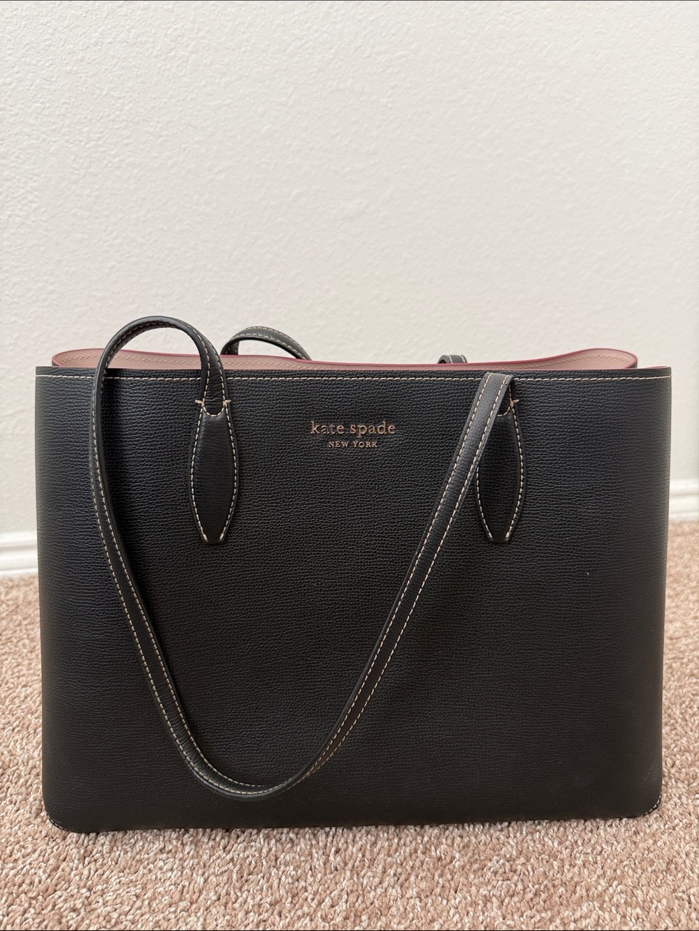 kate spade black tote with pink interior trim